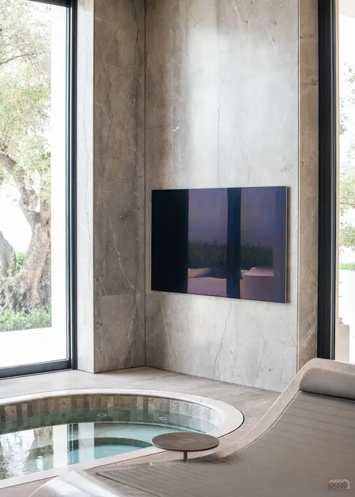 Framed art screen and stone surround at the spa pool