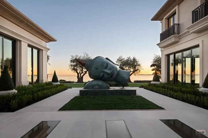 Limestone facade and sculpture court at sunset above the Pacific