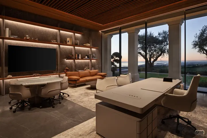 Home office at dusk, the shelf wall lit and terrace columns beyond