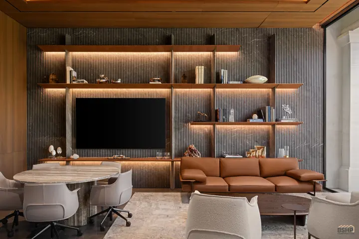 Home office meeting table with sculpted swivel chairs beneath the lit shelf wall
