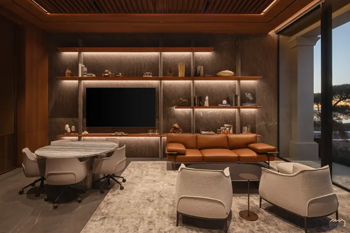 The home office shelf wall at dusk with lounge seating