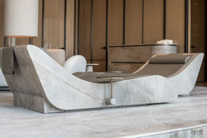 A pair of sculpted stone loungers in the spa suite