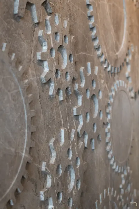 Close detail of the carved relief wall pattern