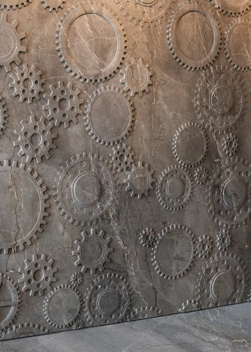 Detail of the hand-sculpted relief stone wall
