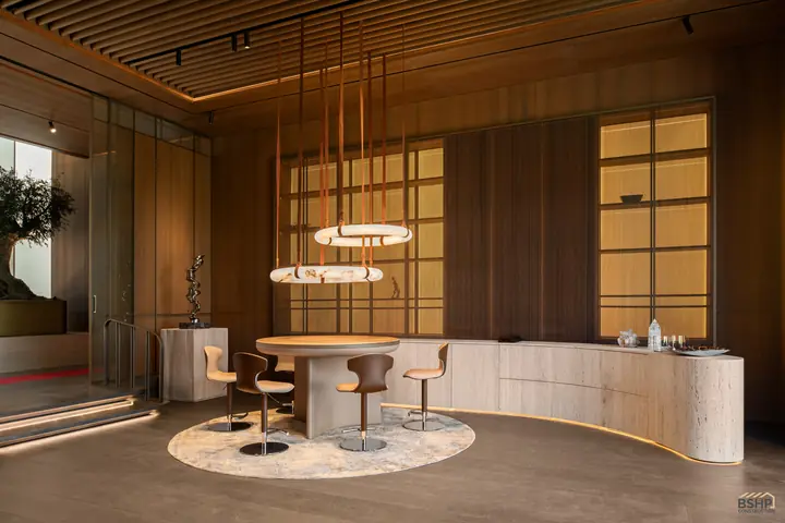 Curved travertine bar and games table in the slatted-ceiling study